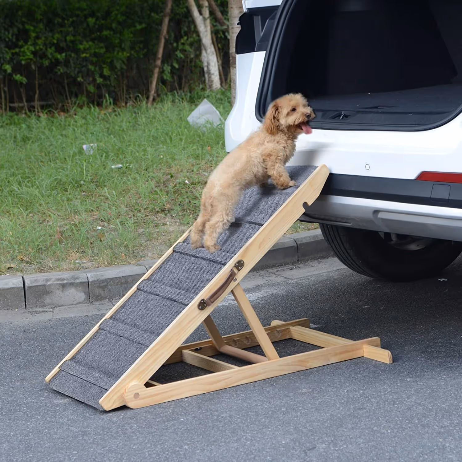 Foldable Pet Car Ramp – Easy Access for Dogs & Cats
Help your furry friend climb in and out of your vehicle with ease using our Foldable Pet Car Ramp. Designed for dogs and cats of all sizes, this lightweight yet sturdy ramp features a non-slip surface and an adjustable incline — perfect for senior pets, small breeds, or those with joint concerns.

🐾 Safe & Secure: Anti-slip grip ensures confident climbing

🚗 Car-Friendly Design: Perfect height for SUVs, hatchbacks, and trunks

🧰 Folds Flat: Easy to store in your trunk or garage

🌲 Natural Finish: Blends beautifully with outdoor settings

🐶 Riggs-Tested: Approved by our in-house product tester (he ran up and down 6 times straight)

Whether it's a road trip or a vet visit, make every adventure stress-free for your four-legged co-pilot.